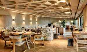 Billede af en moderne restaurant med stilfuld indretning. (AI-genereret tekst)