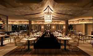 En stemningsfuldt indrettet restaurant med opdækkede borde og komfortable stole. (AI-genereret tekst)