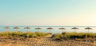 Stranden neden for Ilion Beach