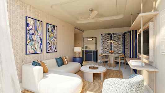 En moderne stue med beige sofa, farverige vægmalerier og bord. (AI-genereret tekst)