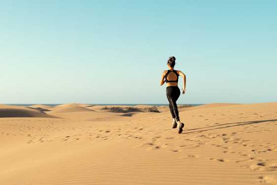 Runner in sand dunes