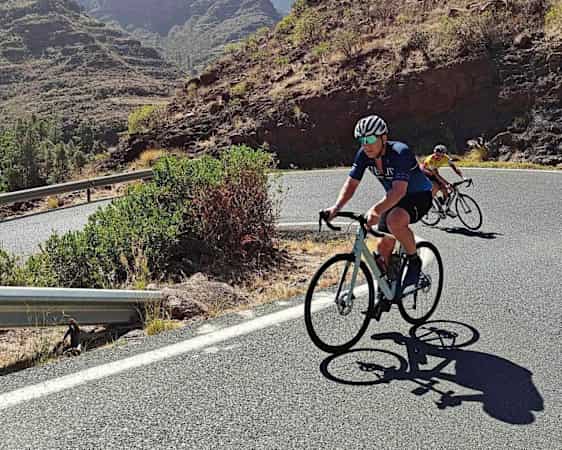 Riders uphill on road