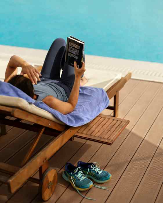 Woman relaxing by the pool