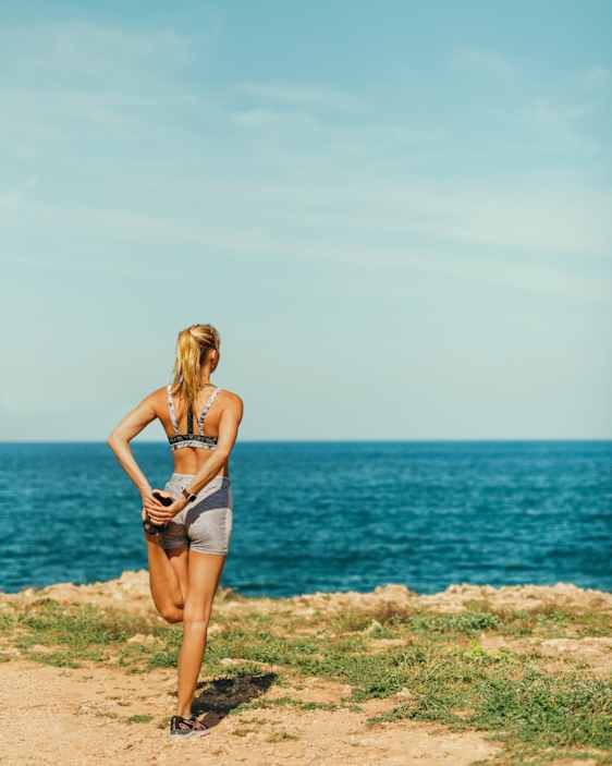 Women streching by the ocean