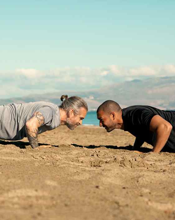Men training on beach
