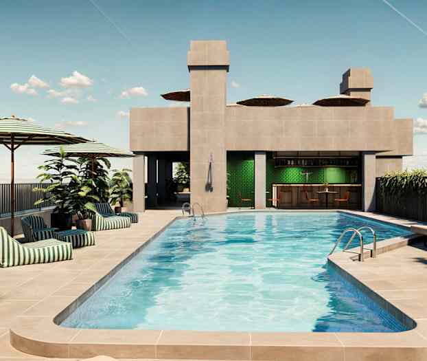 Billede af en tagterrassepool med liggestole, parasoller og en bar. (AI-genereret tekst)