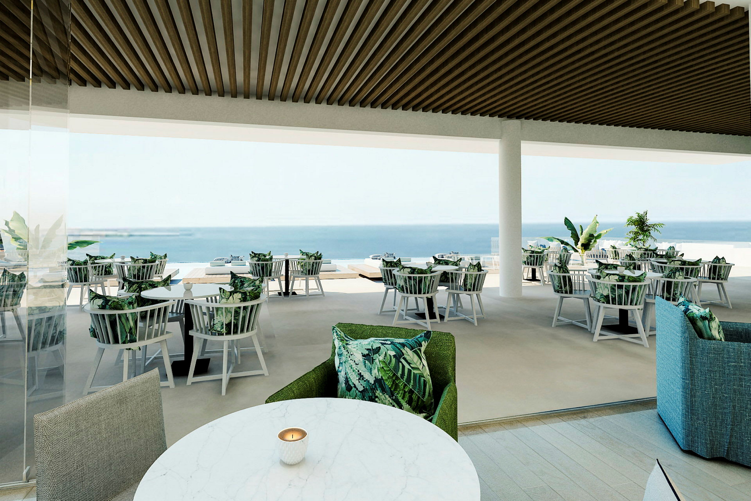 En restaurant med udendørsudsigt. Borde med stole, dekoreret med grønne puder, er placeret på en balkon med udsigt over havet. (AI-genereret tekst)