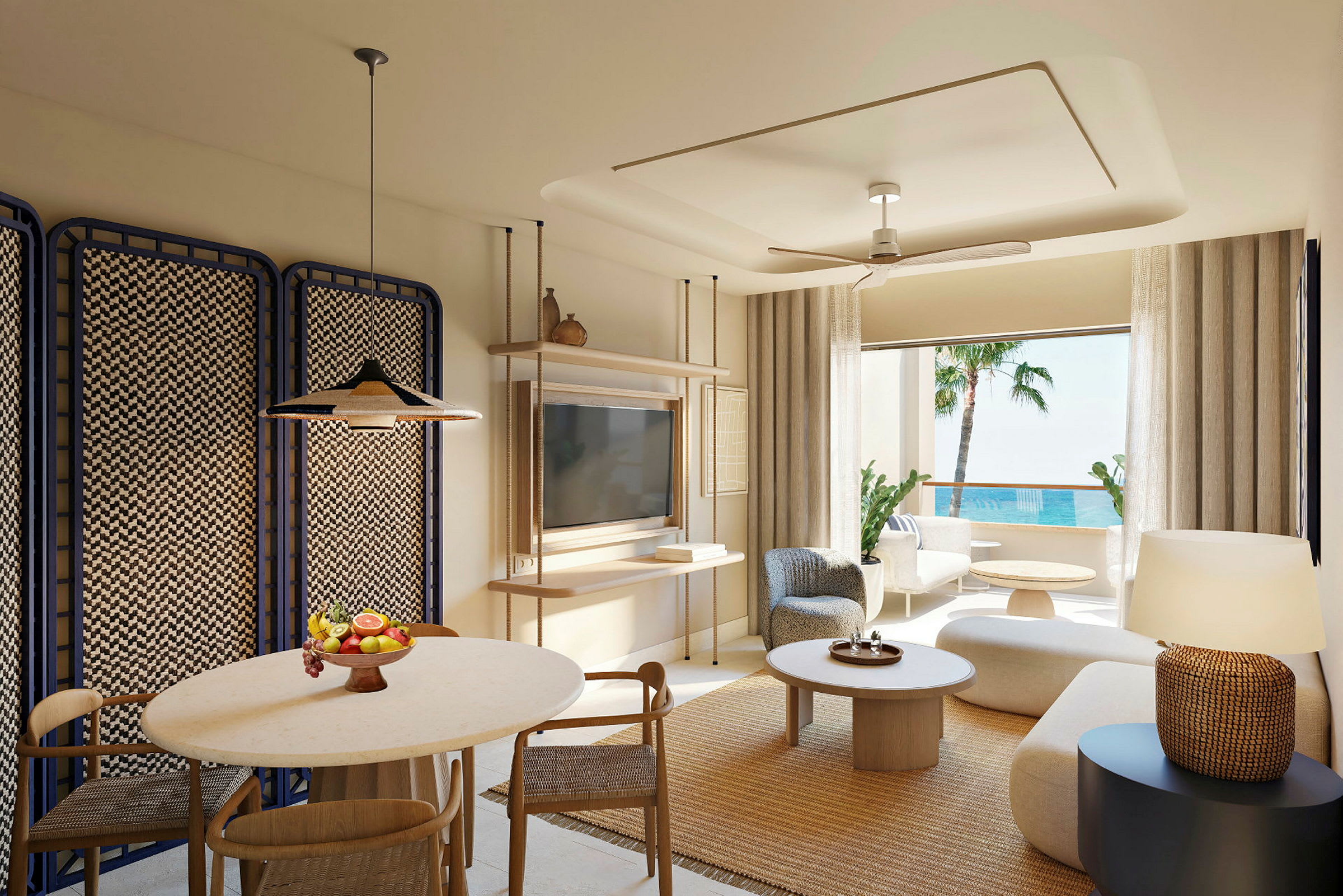 En moderne indrettet hotelsuite med siddegruppe, spisebord og havudsigt. (AI-genereret tekst)