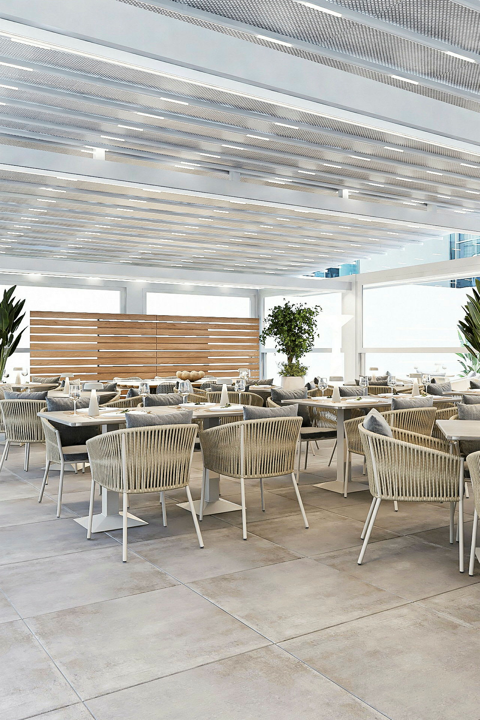En moderne restaurant med komfortable stole og borde placeret i en lys og luftig indretning. (AI-genereret tekst)