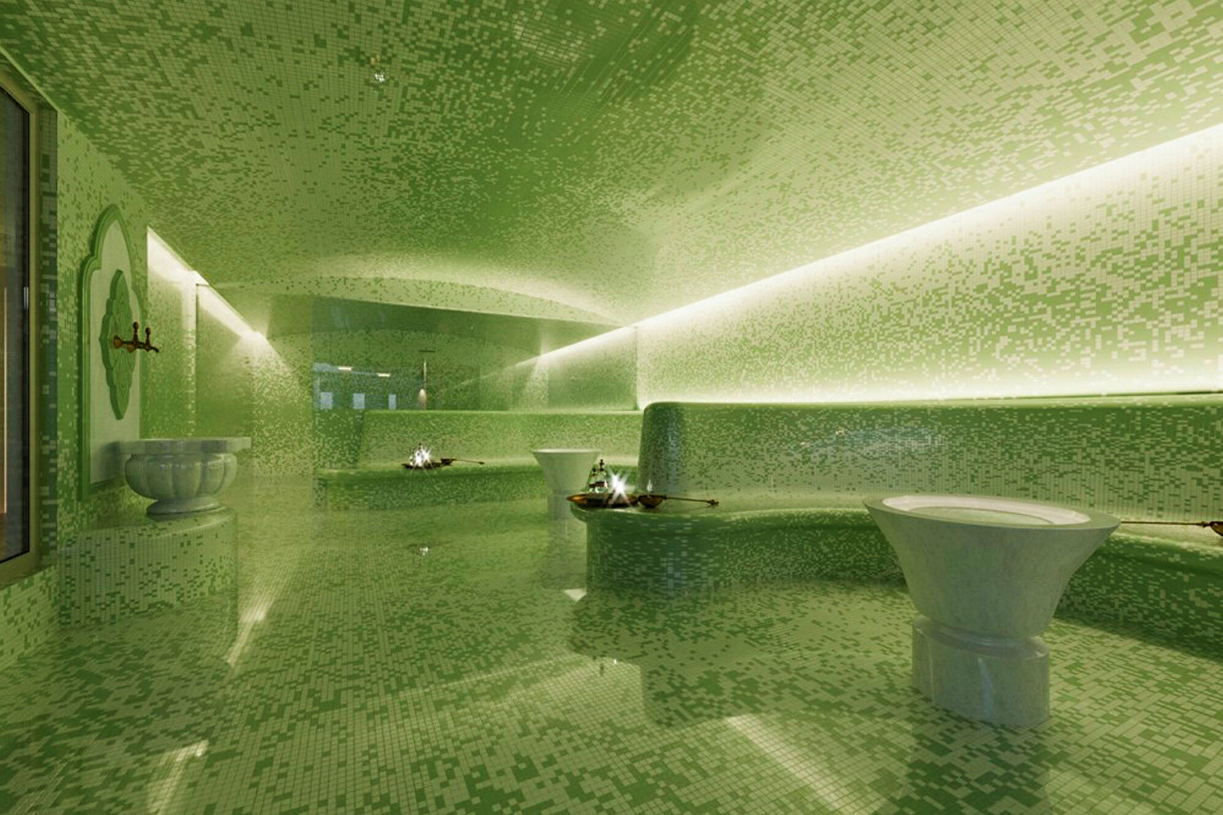 Et moderne spa med grønne mosaikvægge og fontæner. (AI-genereret tekst)