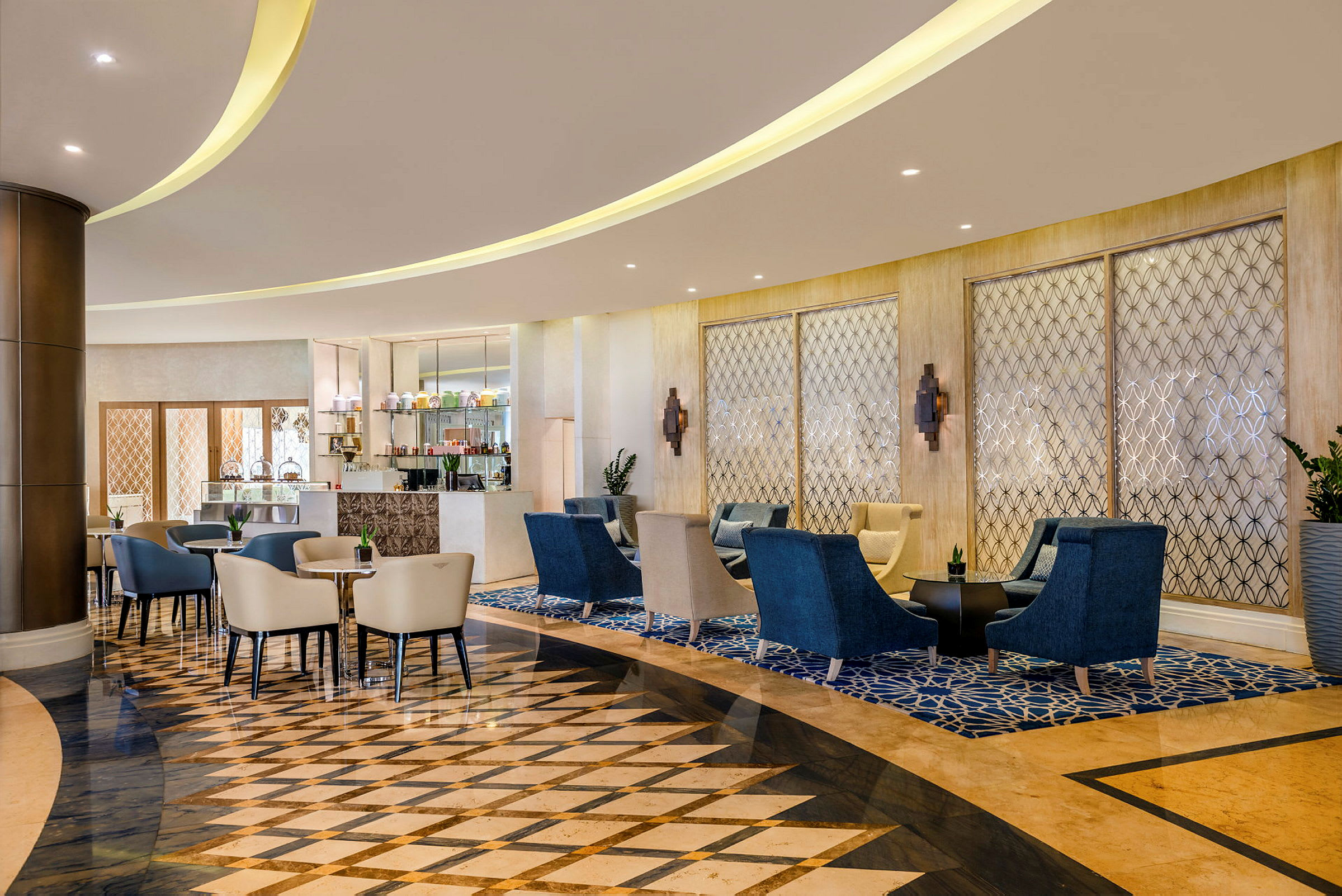 Billede af en moderne café- eller loungeområde med elegante møbler og dekorativt gulv. (AI-genereret tekst)